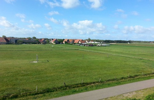 Buren Apartment | Ameland - apartment with balcony to the south side with a view of meadows and the village of Buren