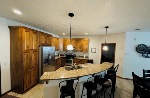 Arnolds Park Condo | Bridges Bay spacious, well-stocked kid-friendly home. 6 Pool Passes. Sleeps Ten