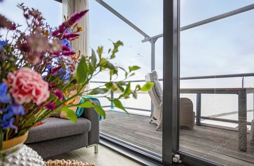Kamperland House | Uniquely situated 4-person holiday apartment with panoramic views of Lake Veere.